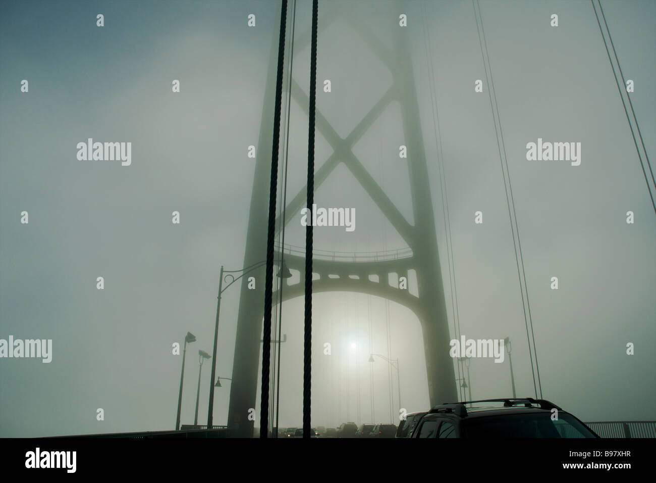 Lions Gate Bridge in fog, Vancouver, British Columbia Stock Photo