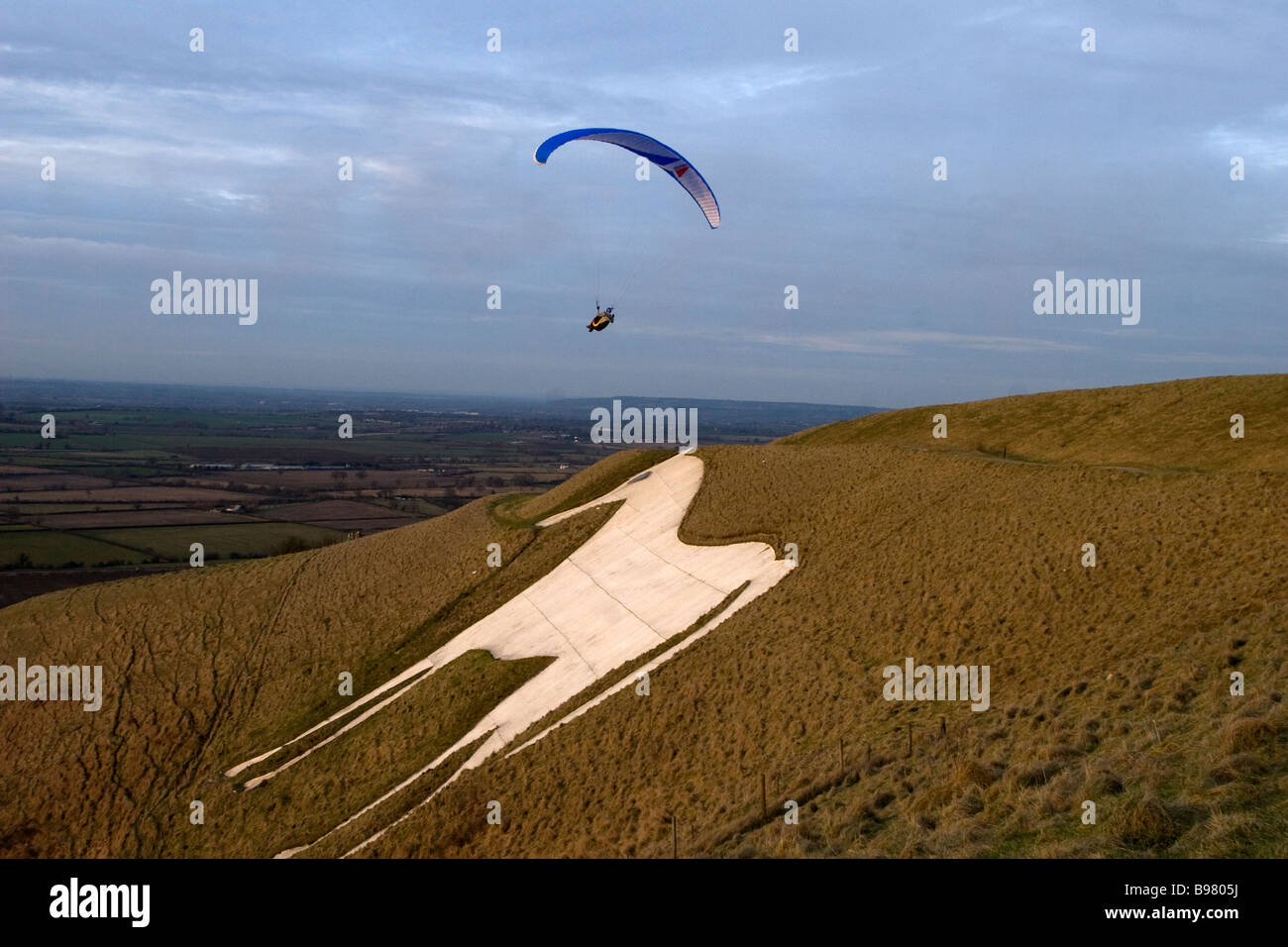 Paraglider at Westbury white horse Stock Photo