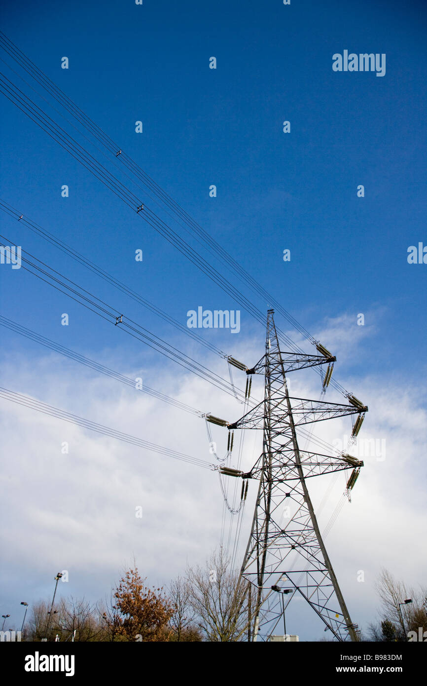 ELECTRICAL POWER PYLON WITH SUPPLY CABLES AGAINST A CLOUDY SKY, Credit ...