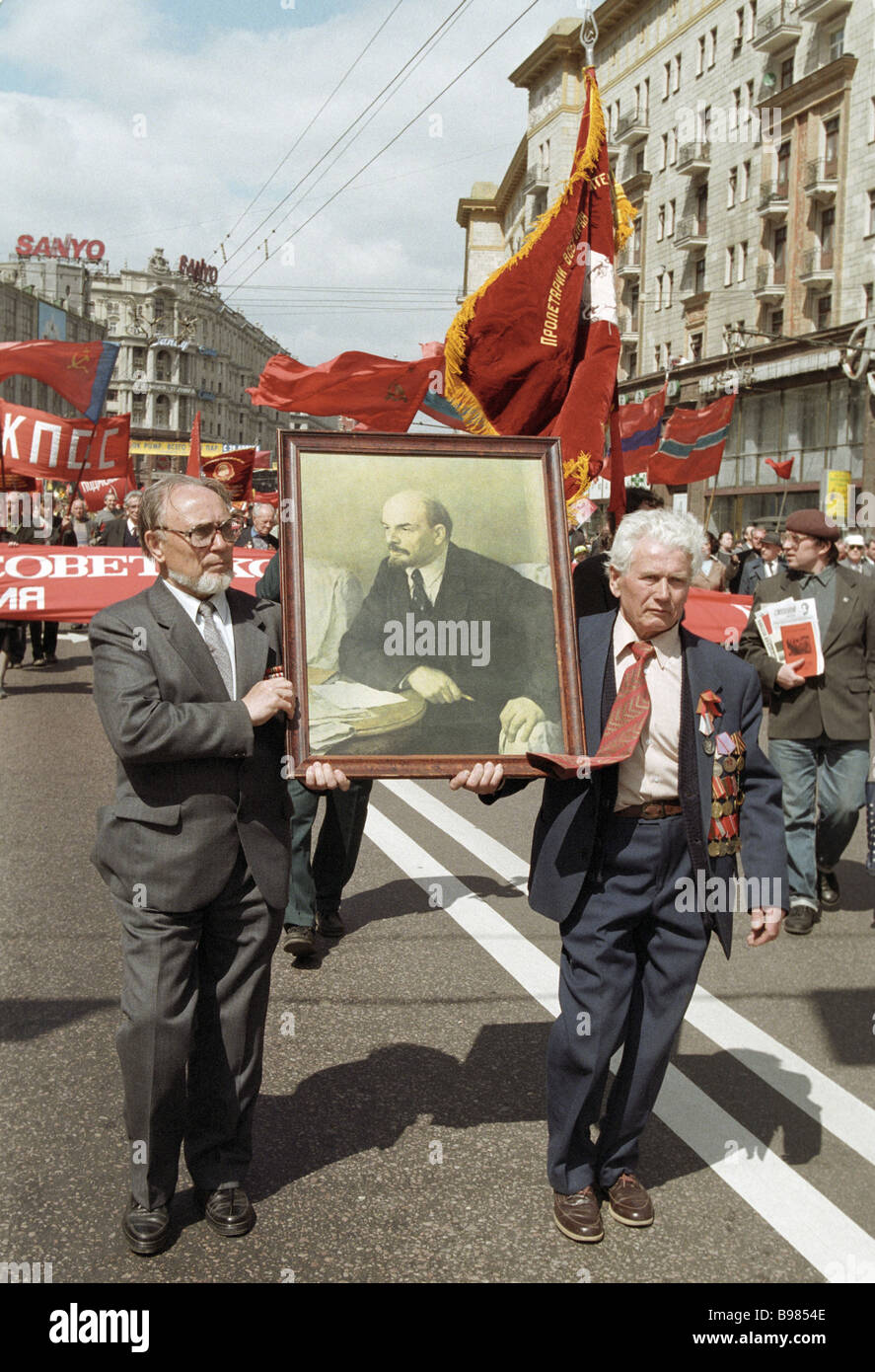 War veterans with portraits of Lenin lead a column of Communist Party ...