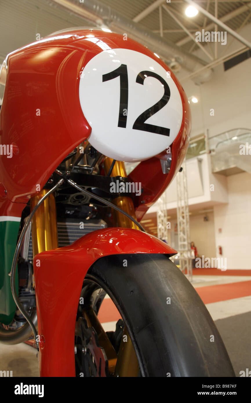 one classic racing motorbike with number 12 at motor show Stock Photo