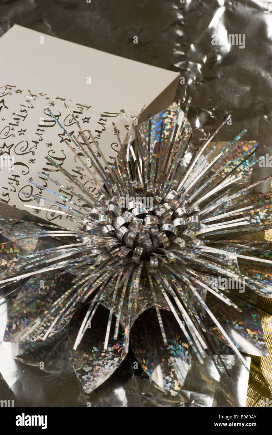 Christmas gift wrap, tag and bow Stock Photo Alamy