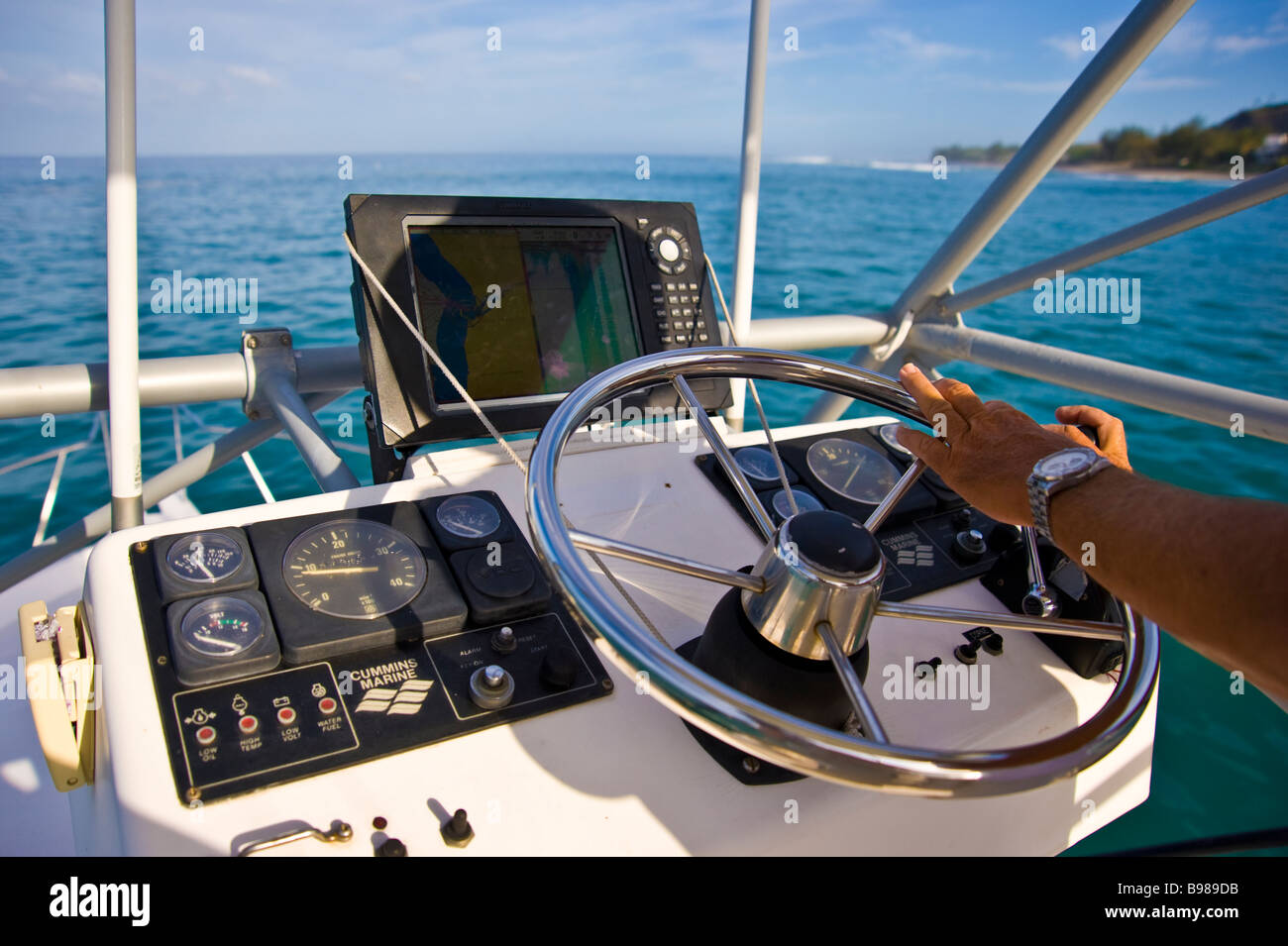 Big game fishing. fishermen on helm of fishing boat Saint Gilles La Réunion  France | Fischer am Ruder eines Angelbootes Stock Photo - Alamy
