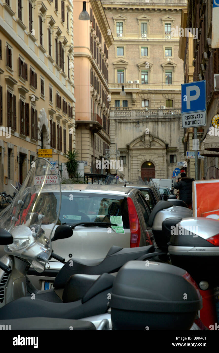 Narrow city street Typical parking in Rome Cars Motorcyles Scooters All