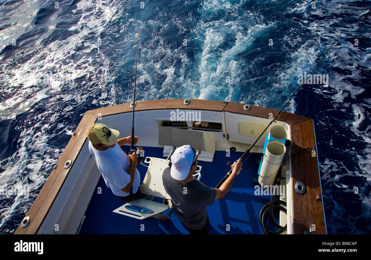 Big game fishing, fishermen on fishing boat. Saint Gilles. La Réunion. France | Hochseeangler auf Angelboot Fischerboot Stock Photo