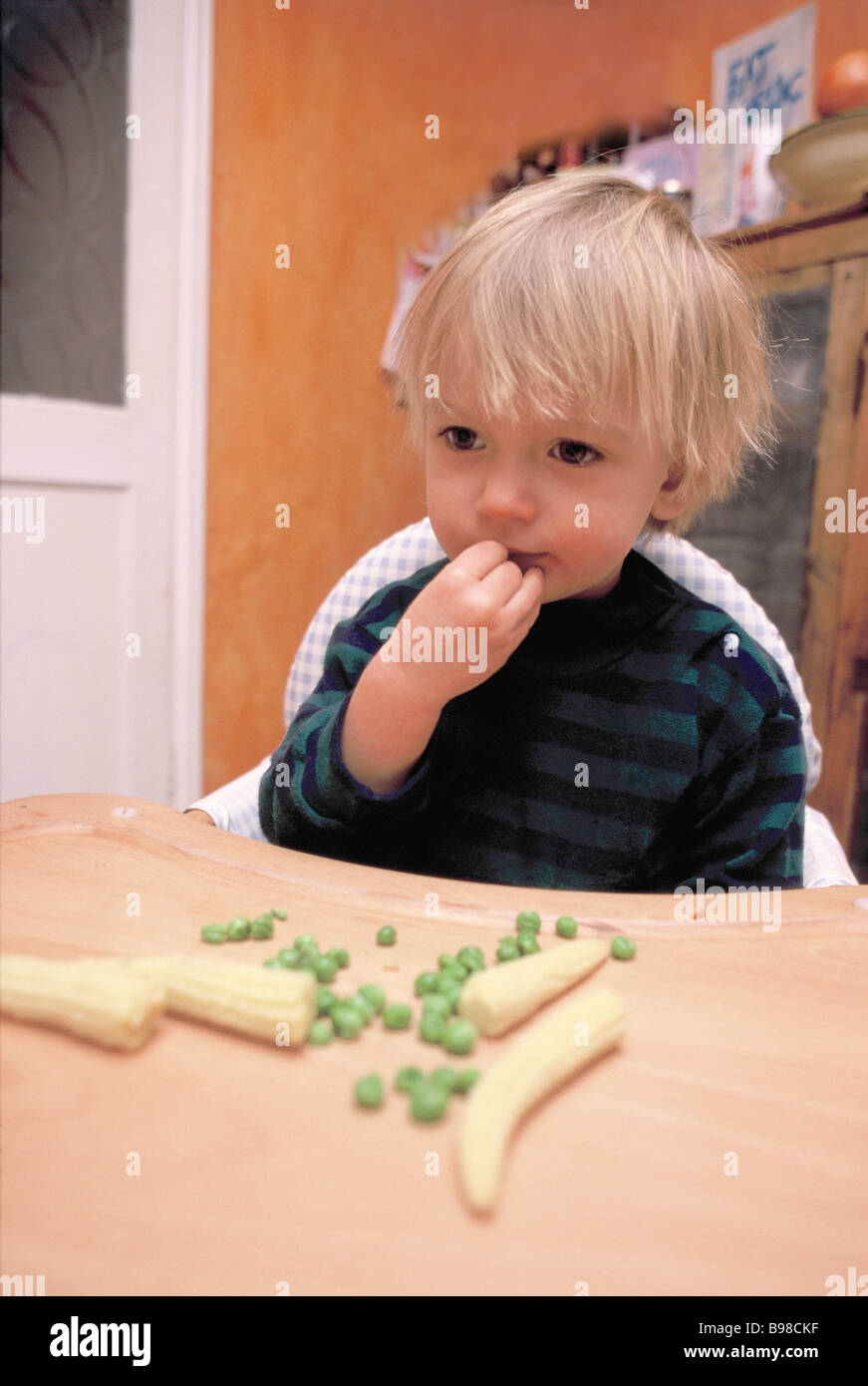 A young child upset at mealtime Stock Photo