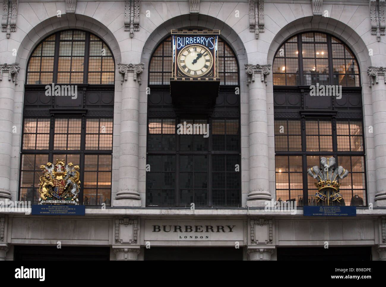 The clock on the wall outside the Burberry headquarters in Haymarket London  Stock Photo - Alamy