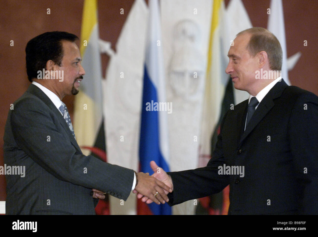 Russian President Vladimir Putin during a meeting with Sultan of Brunei Hassanal Bolkiah right to left in the Kremlin Stock Photo