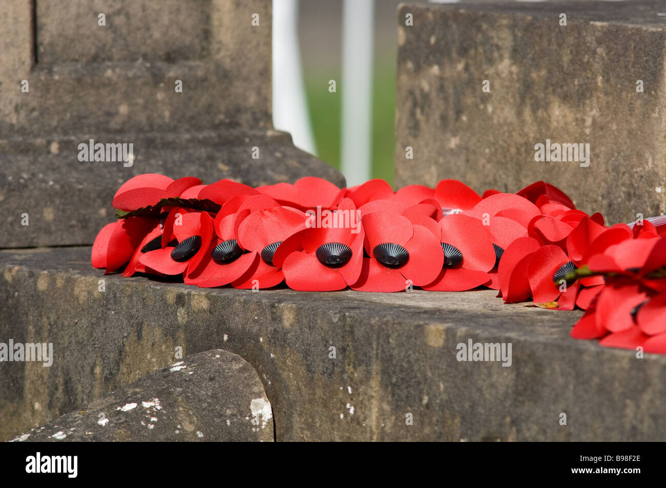 Poppy wreath laid at a war memorial Stock Photo