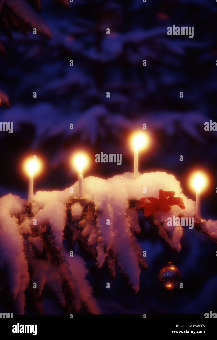 Candlelight on a Christmas tree. Stock Photo