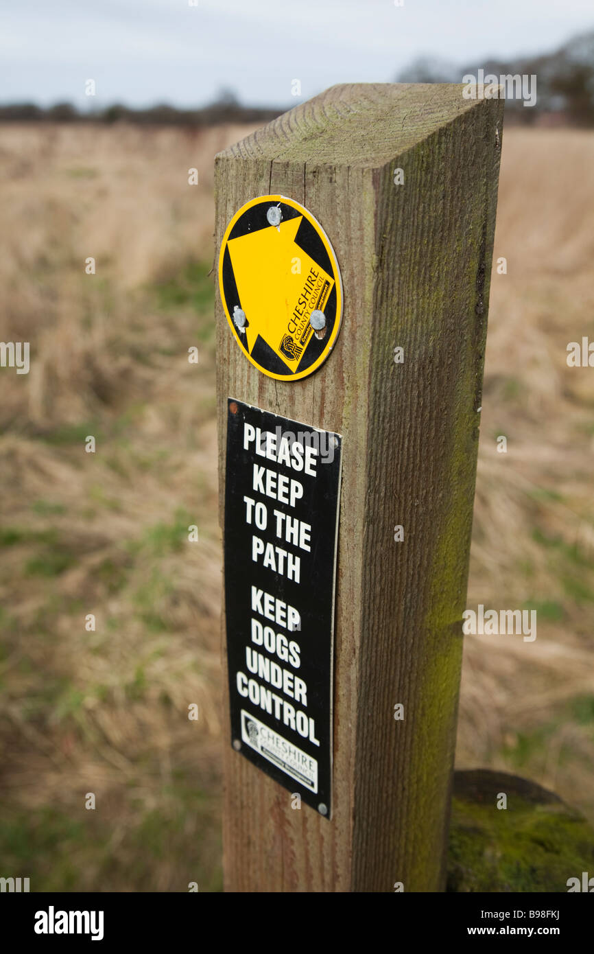 Please keep to the path and keep dogs under control signs Stock Photo