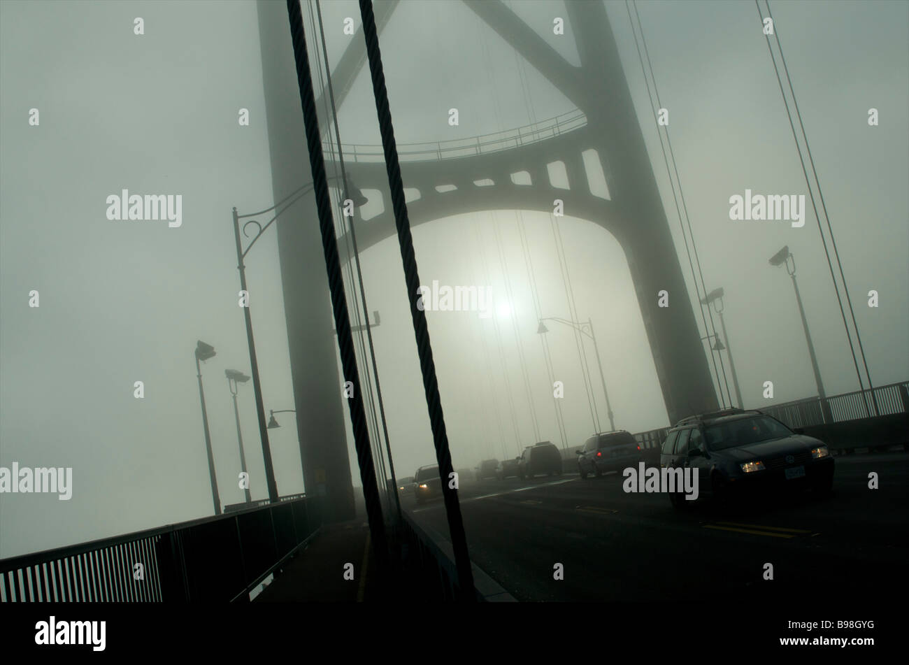 Lions Gate Bridge in fog, Vancouver, British Columbia Stock Photo