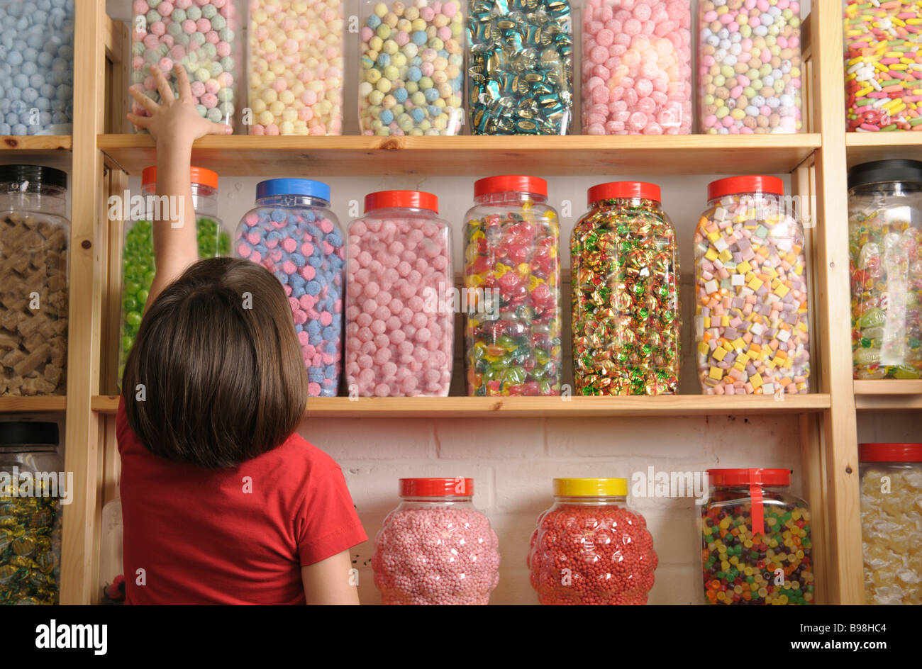 child in sweet shop Stock Photo
