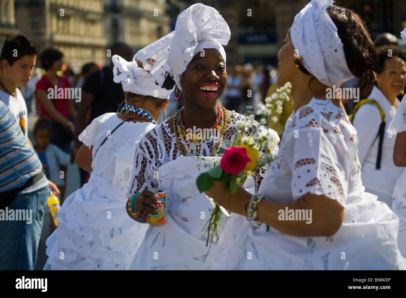 Baianas, bahian mae-de-santos in traditional white dress dancing at a candomble parade in Paris, France. Stock Photo