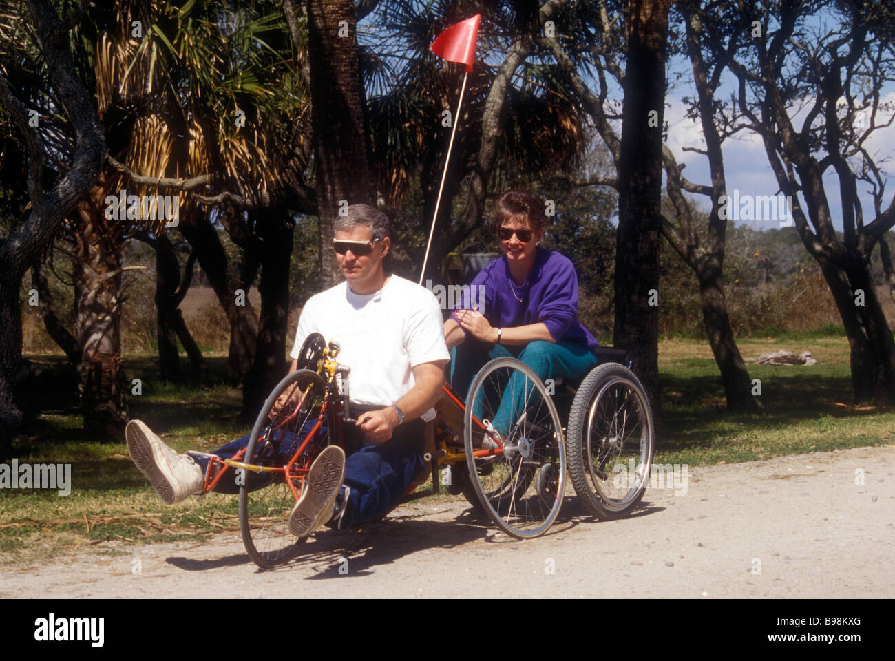 Disabled Man Takes Able Bodied Wife For Ride Stock Photo