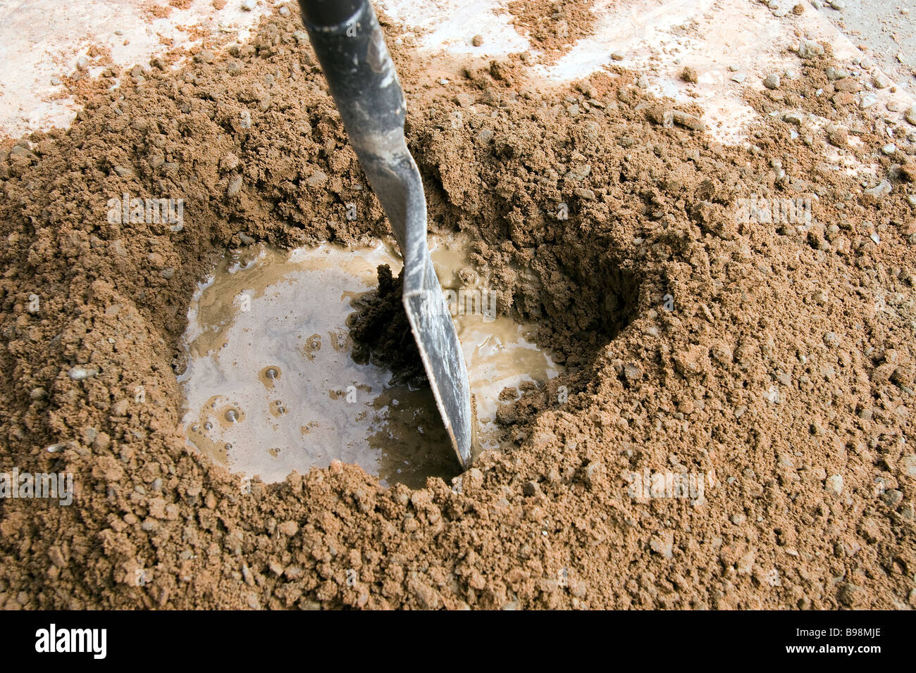 Sand and portland cement have been mixed together and water is added
