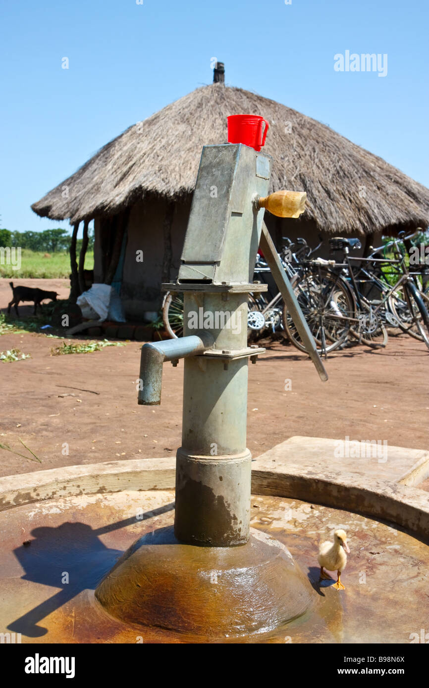 Water pump in northern Ugandan IDP Camp Stock Photo