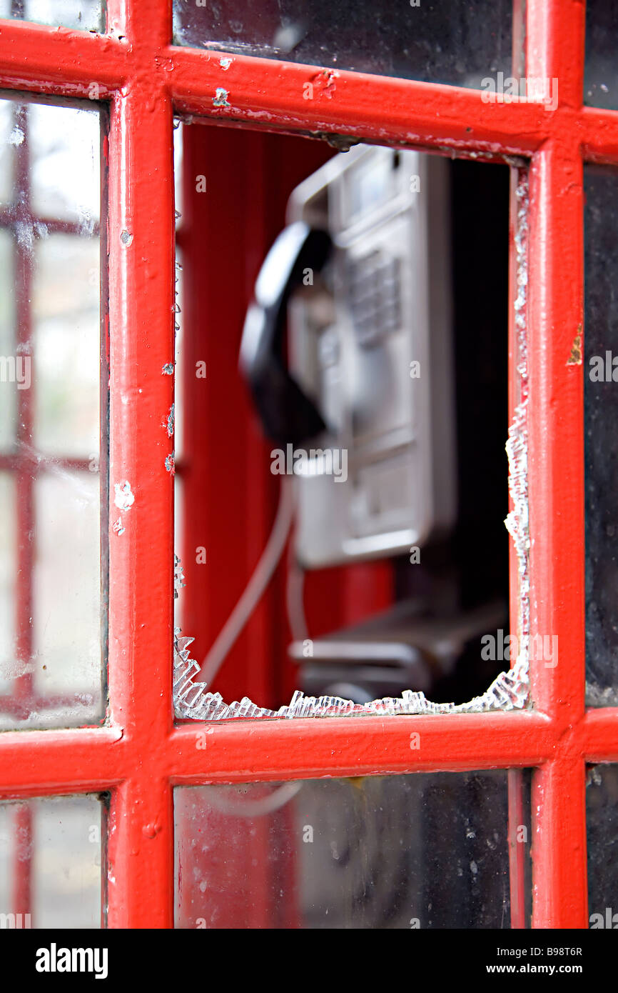 Vandalised British red K6 telephone box Stock Photo