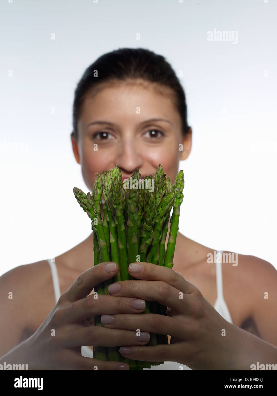 Young Women holding fresh vegetables Stock Photo
