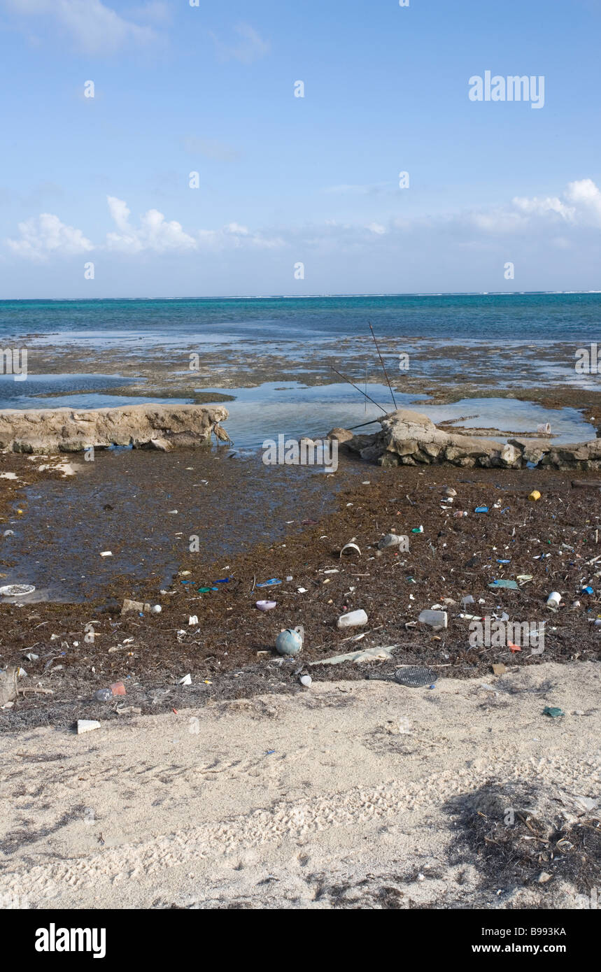 Pollution, trash, and debris washes up onto the shore from the open waters of the Gulf of Mexico. Stock Photo