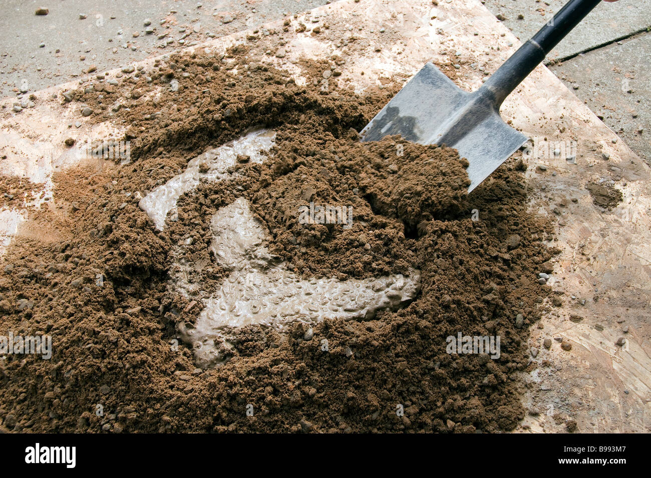 The correct measure of portland cement is mixed with sand and water to