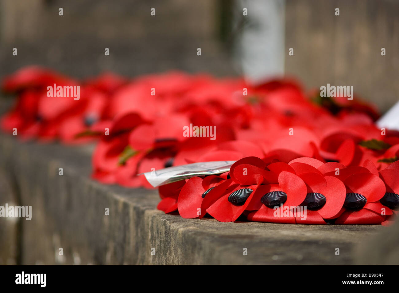 Poppy wreath laid at a war memorial Stock Photo