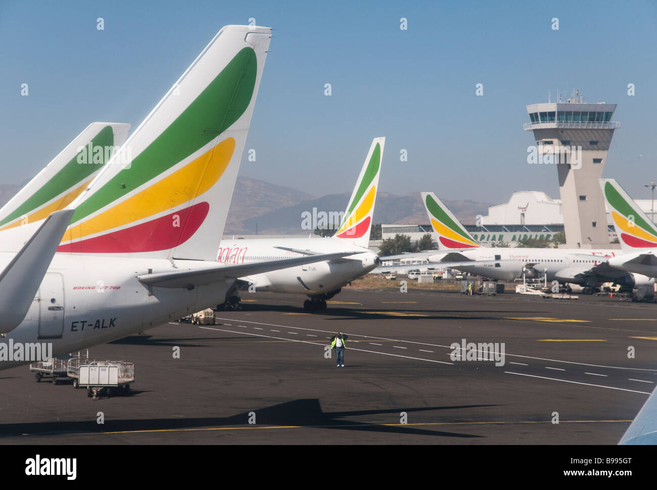 East Africa Ethiopia Addis Abeba International airport Ethiopian airlines planes with control tower in bkgd Stock Photo