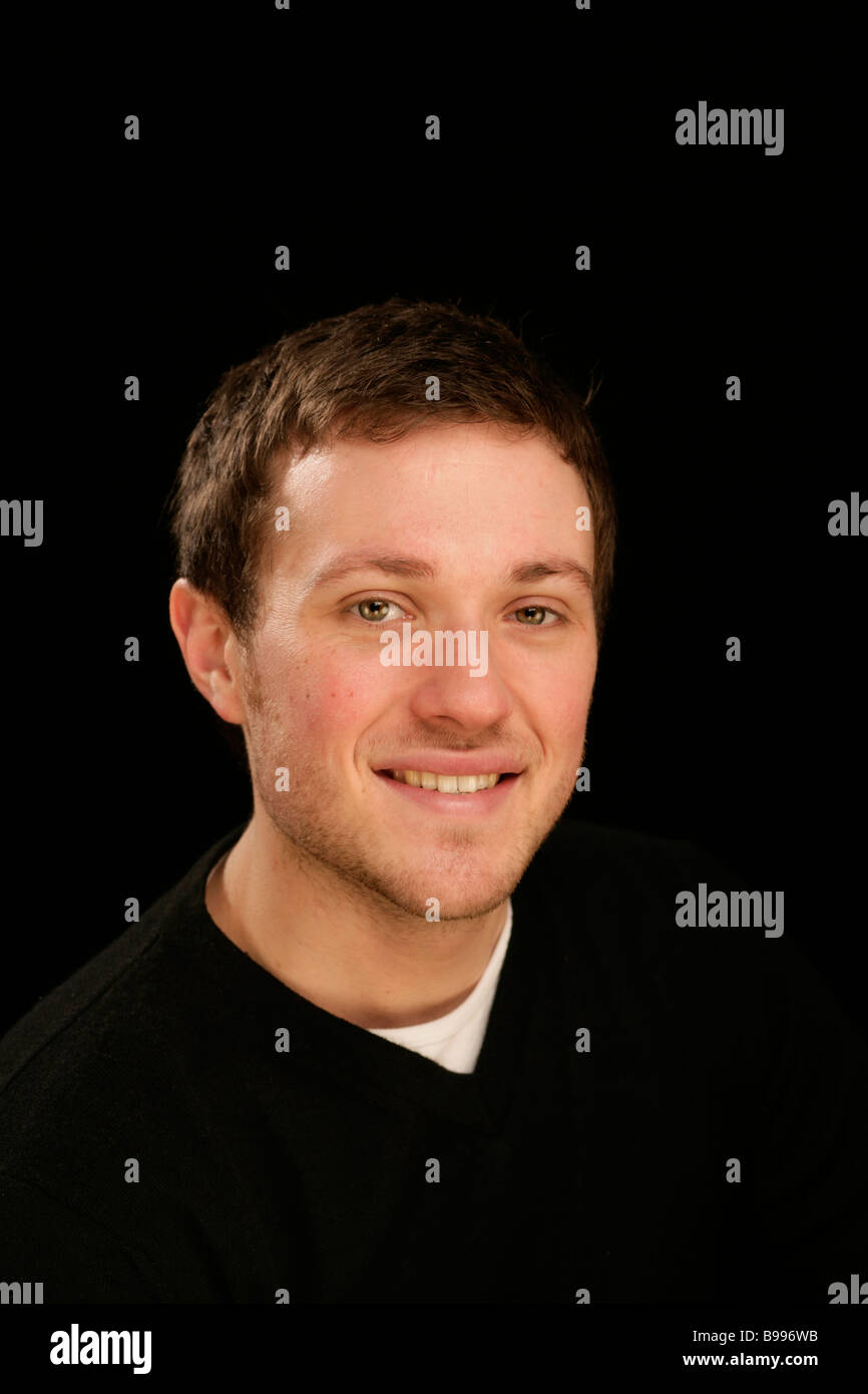 happy teenager young handsome man head and shoulders cool confident assured Stock Photo