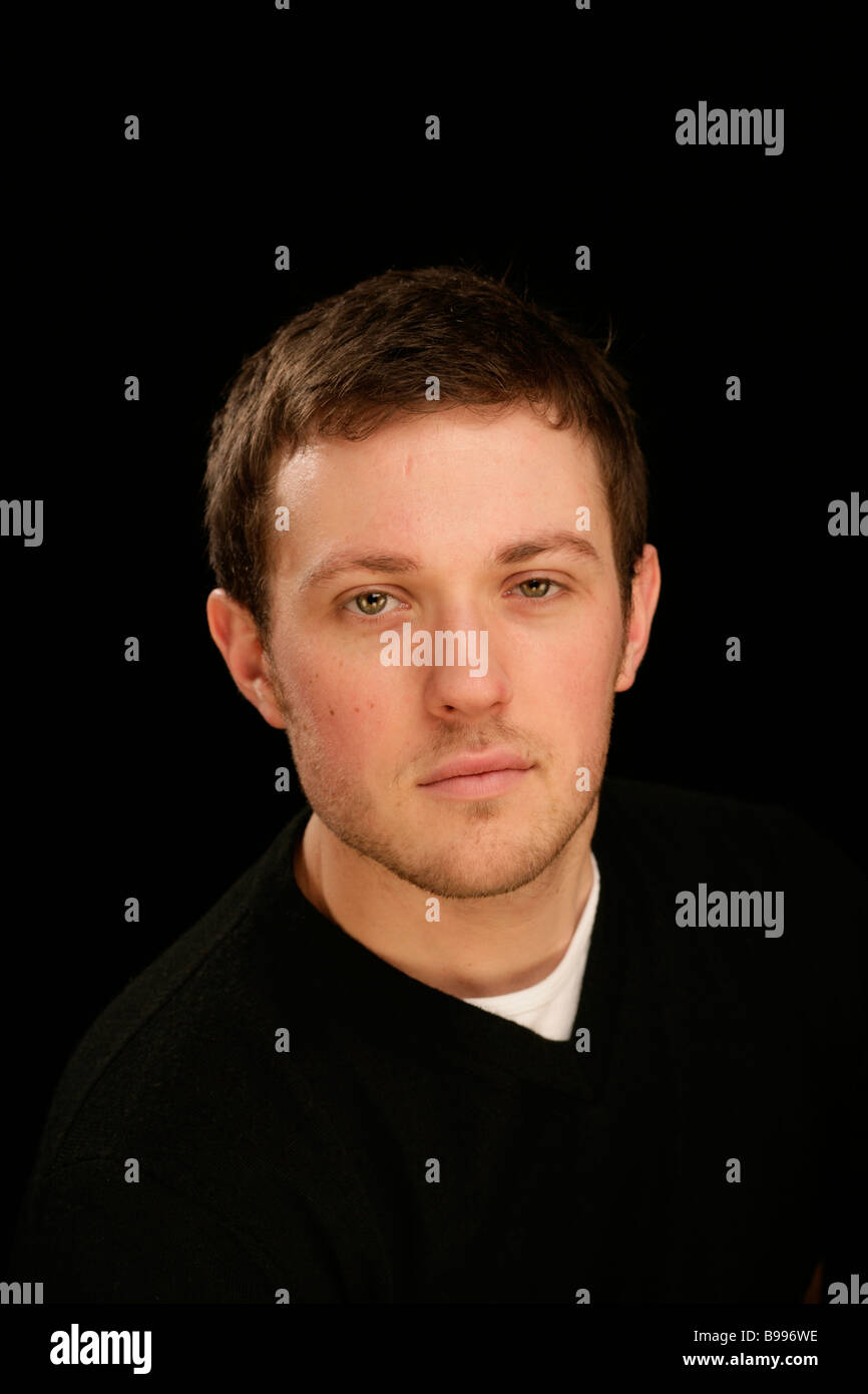 young handsome man head and shoulders cool confident assured Stock Photo Alamy