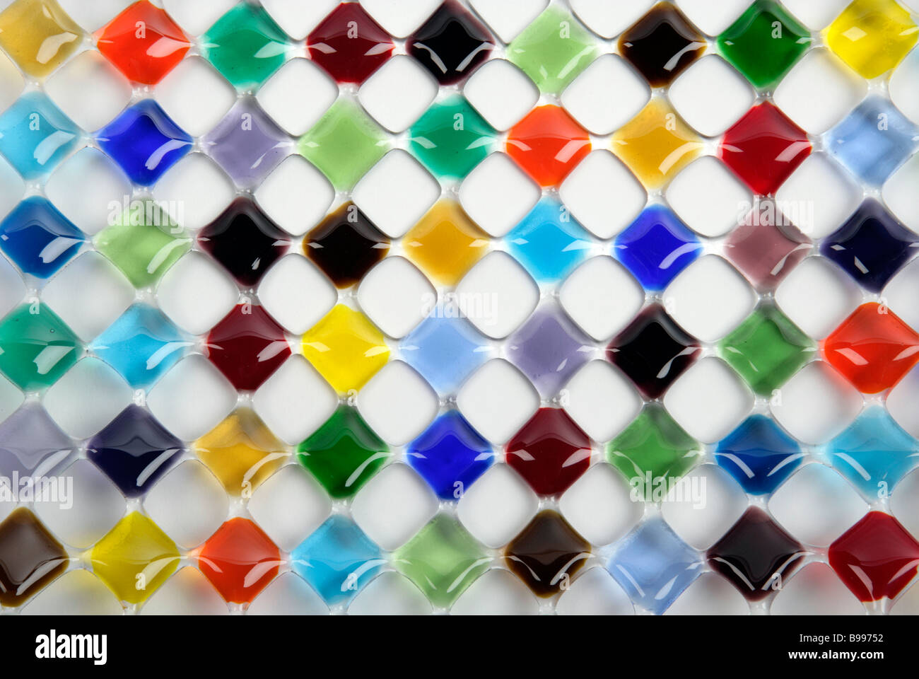 bold graphic mix of coloured diamonds or squares made in glass Stock Photo