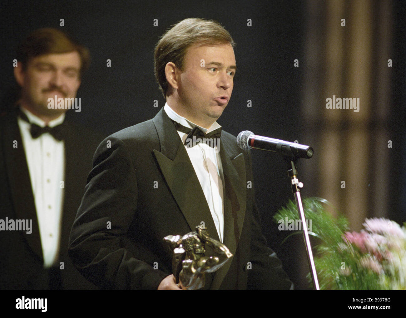 Yevgeny Kiselyov left and TV journalist Andrei Karaulov right getting ...