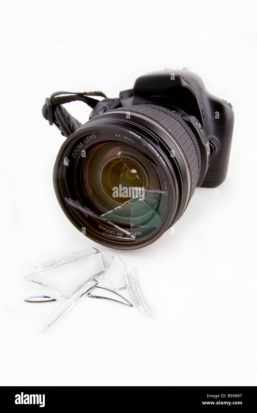 A consumer DSLR with a smashed lens Stock Photo