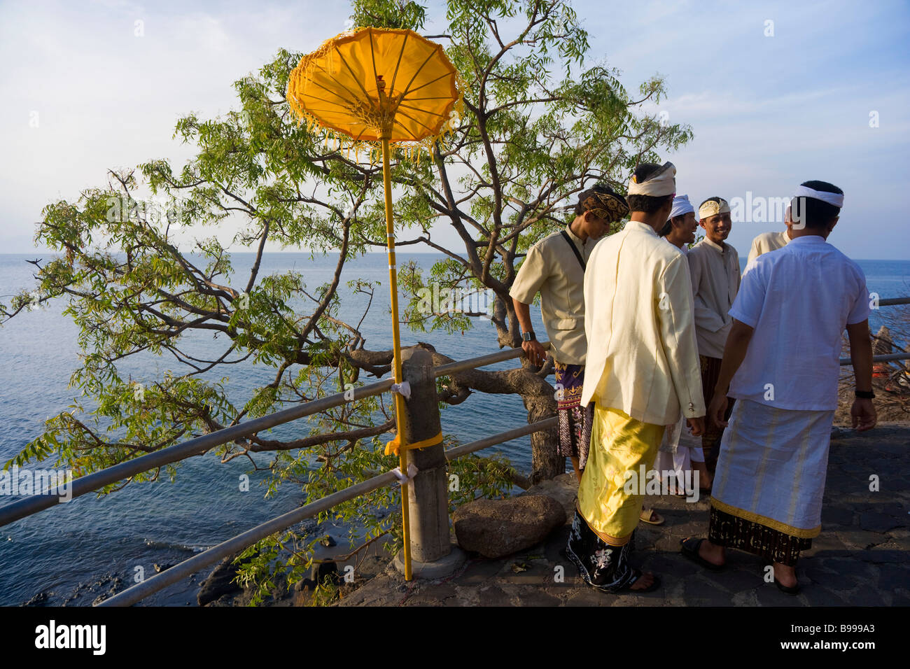 Men outside Paben temple North West Bali Indonesia Stock Photo