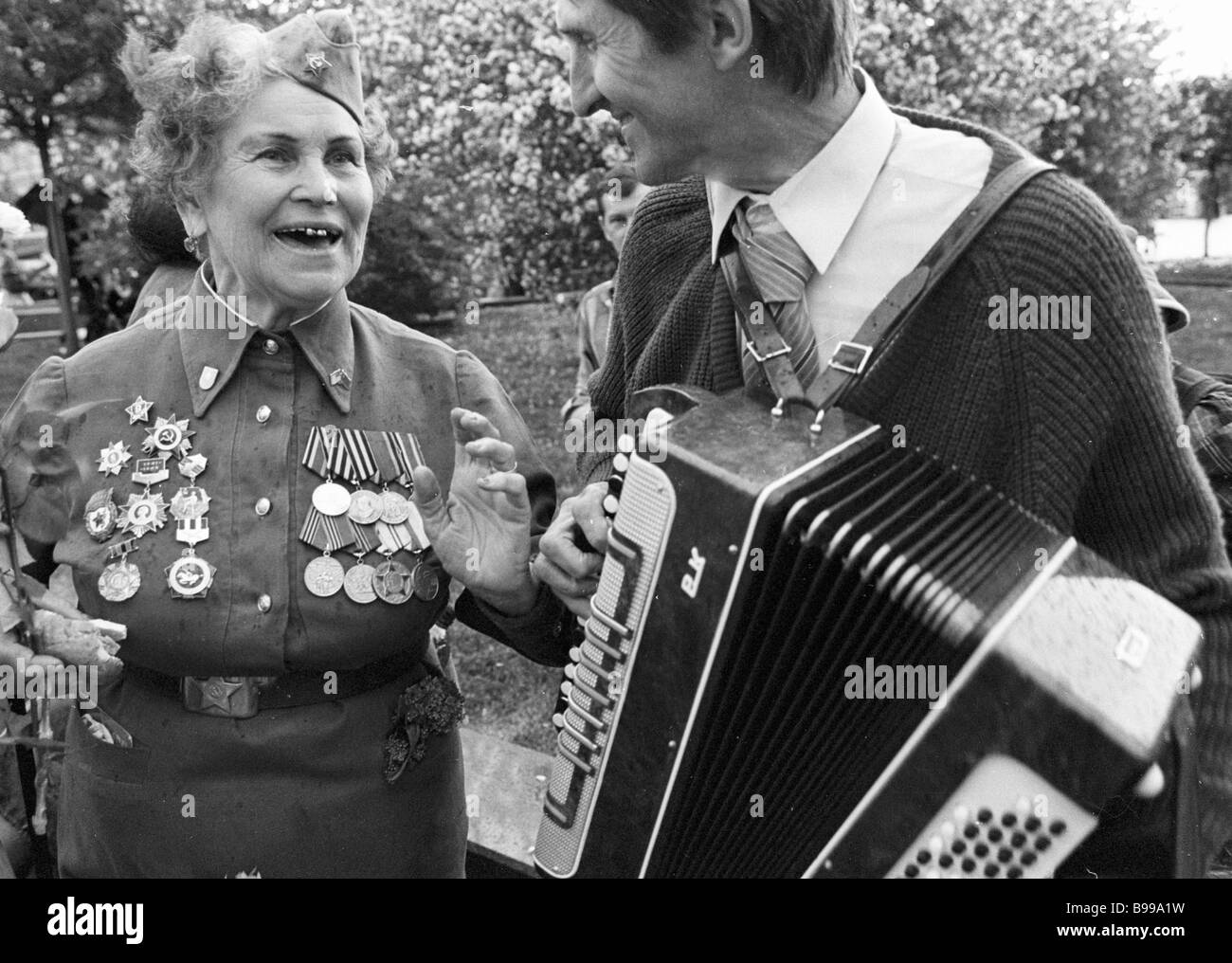 World War II veterans meet in the public garden outside the Bolshoi on ...