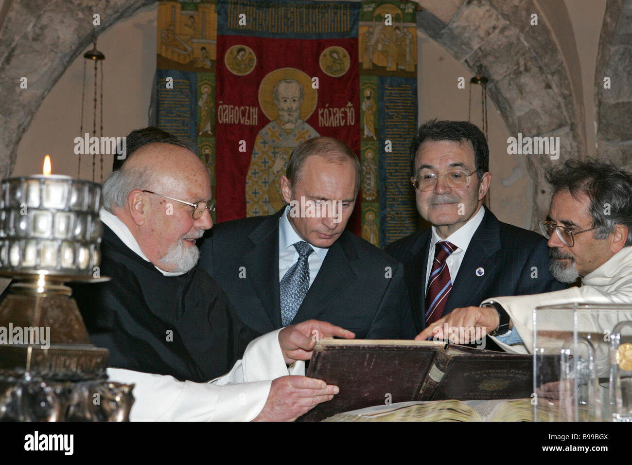 From left to right Padre Damiano Bova the Rector of the Basilica di San  Nicola Russian President Vladimir Putin and Italian Stock Photo - Alamy