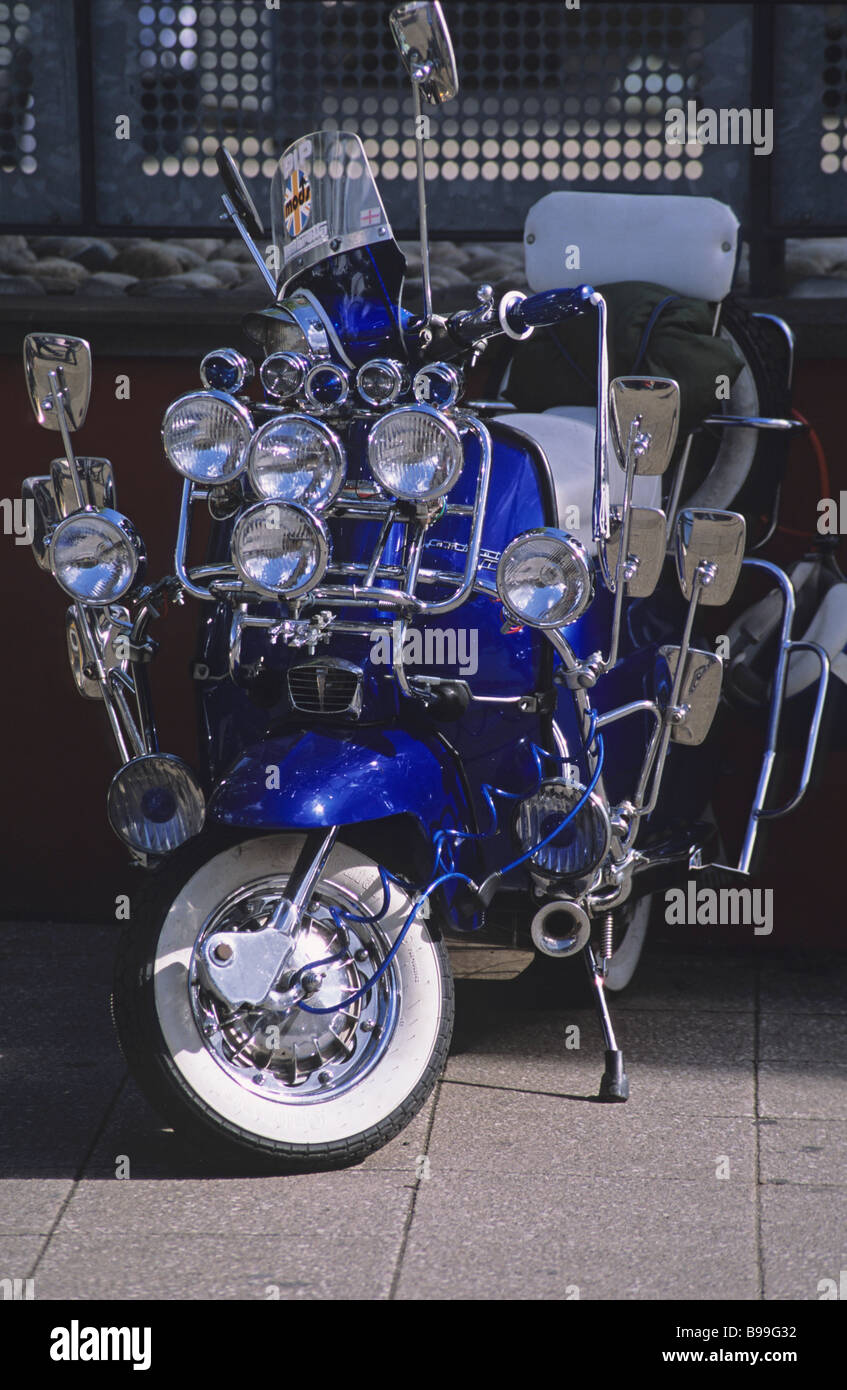 A Mod s Vespa  scooter with many mirrors and lights Stock 
