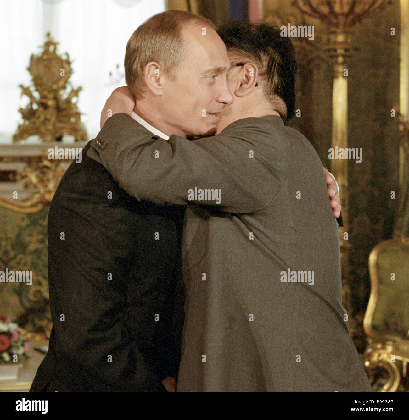 Korean leader Kim Chong il right friendly embracing Russian President Vladimir Putin left in the Green reception room of the Stock Photo