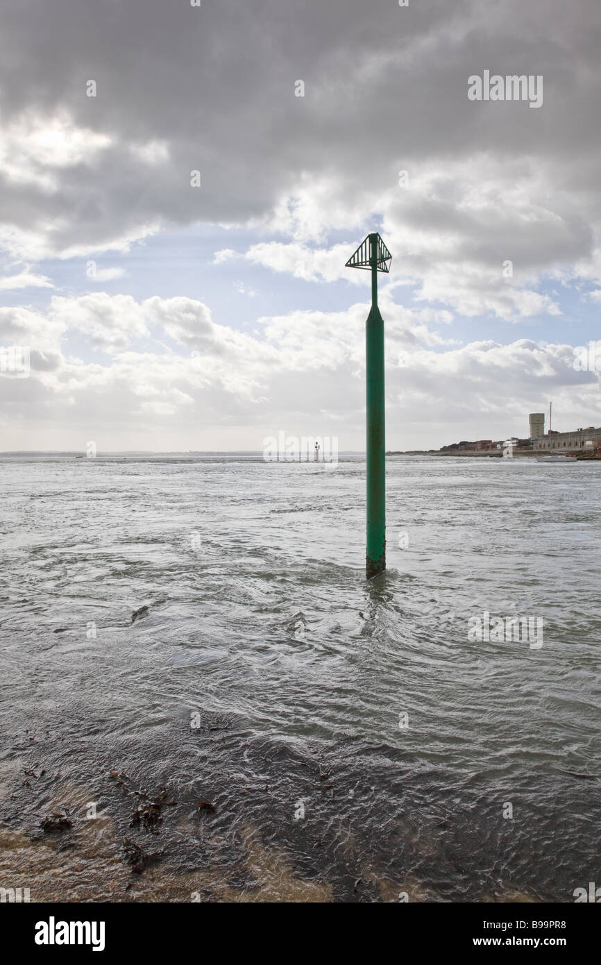 The ebbing tide demonstrated by the swirl around the Starboard Hand