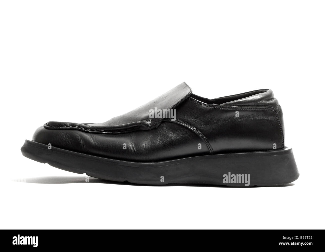 Mens black leather slip on shoe on white backgorund Stock Photo