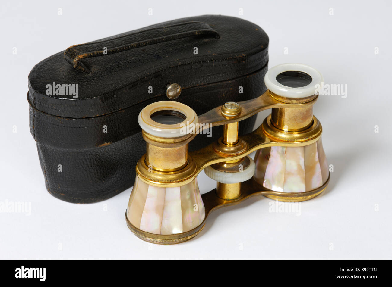 A pair of brass antique French opera glasses veneered with motherofpearl and with original