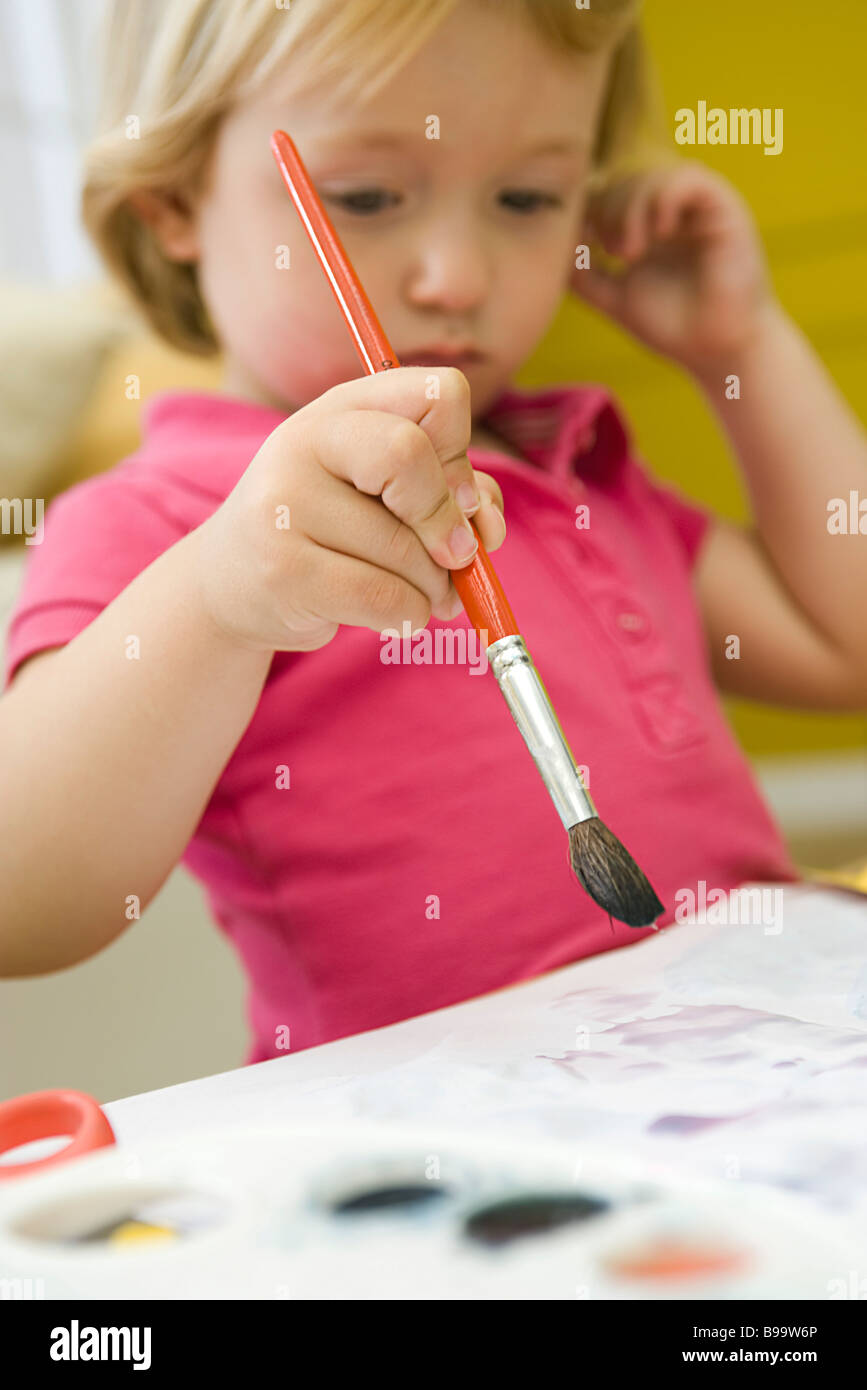 Toddler girl painting Stock Photo Alamy