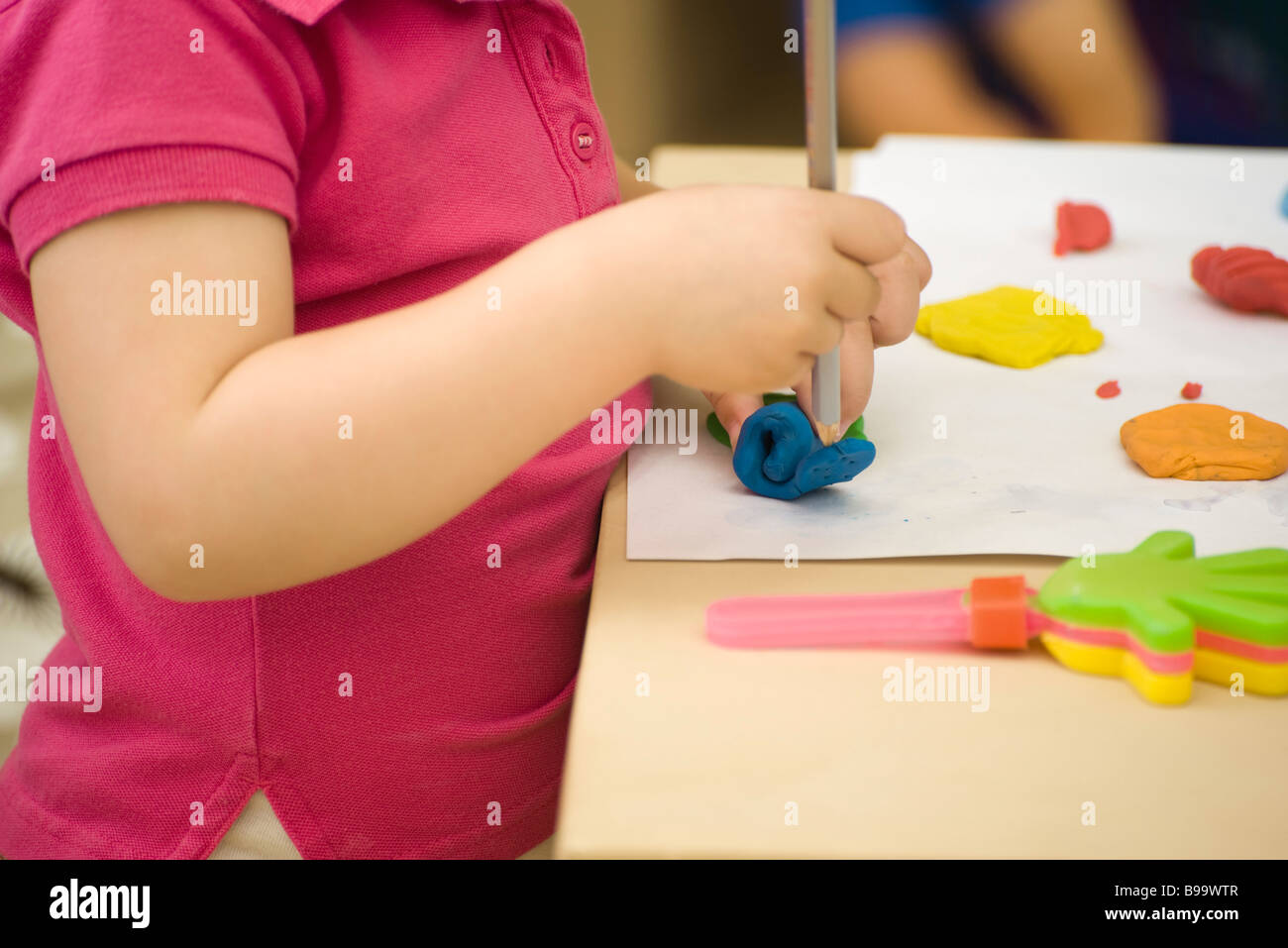 Child molding clay pencil cropped hires stock photography and images Alamy