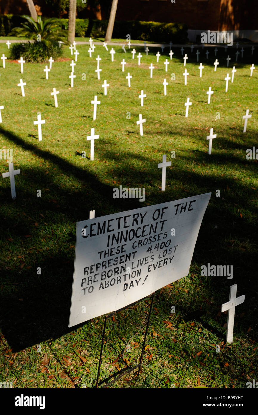 Crosses and sign on church lawn represent abortions performed Stock Photo