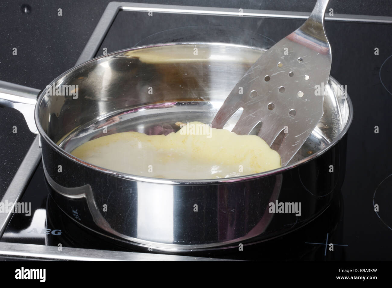 Woman Flipping Pancake Model Released Stock Photo