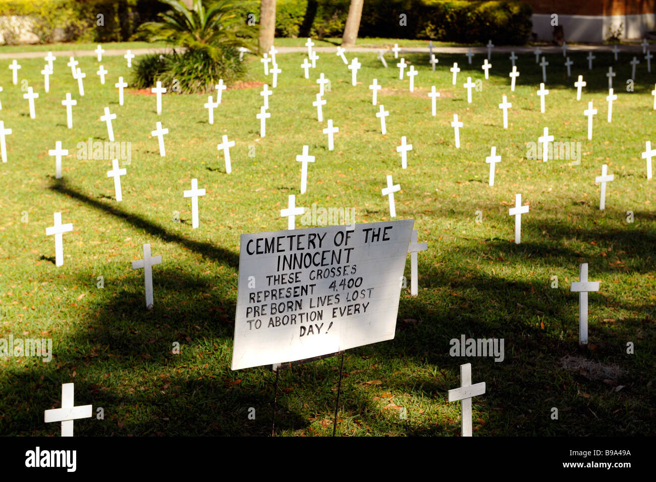 Crosses and sign on church lawn represent abortions performed Stock Photo