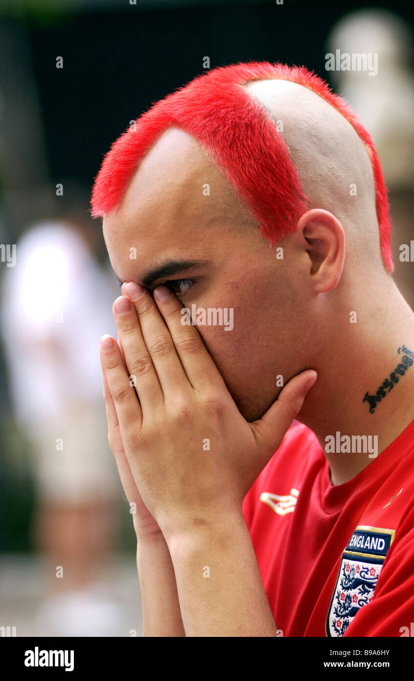 Disappointed football fan in red hires stock photography and images