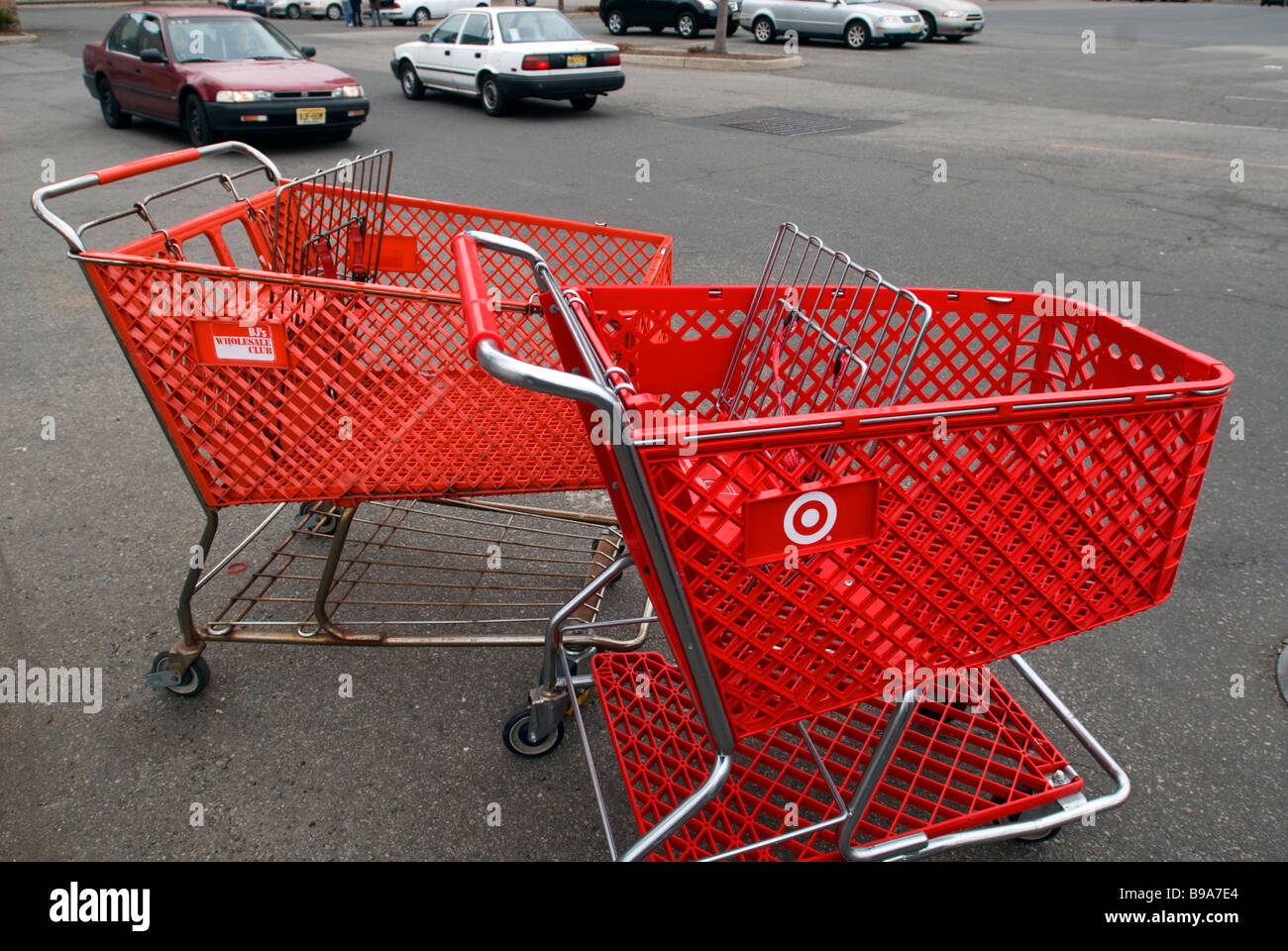 Shopping carts belonging to BJ s Wholesale Club and Target in a parking lot in a mall in Jersey City NJ Stock Photo