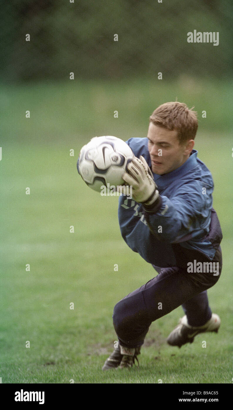 The Russian national football team s goalkeeper Igor Akinfeyev trapping the ball Stock Photo