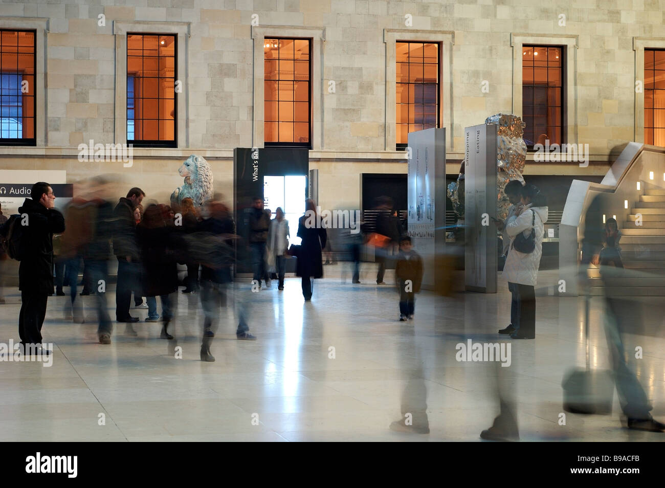 The British Museum, London. Interior of 'The Great Court' (Time lapse image shows visitors as ghostly figures). Stock Photo