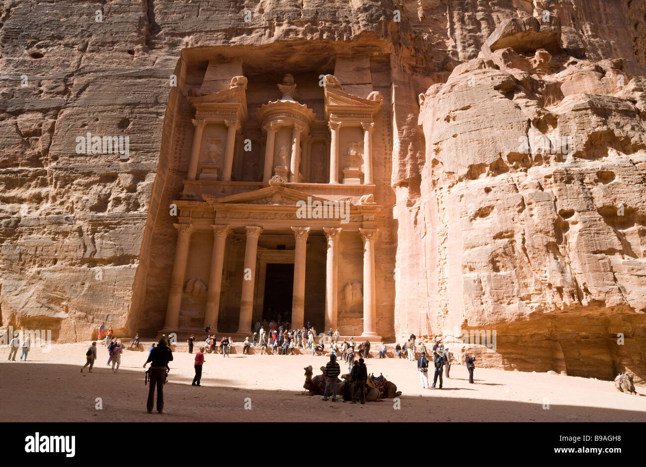 Camels and tourists in front of the Treasury, Petra Jordan, Middle East Stock Photo
